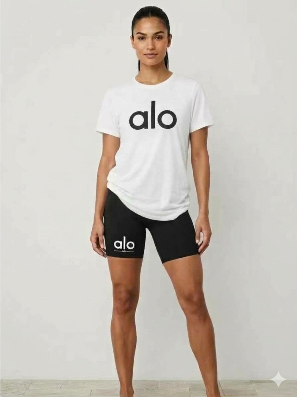 New Alo Yoga Black High-Rise Bike Shorts with white short-sleeve t shirt long